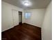 Cozy bedroom with hardwood floors, closet, and a window offering lots of natural light at 6545 Netherseal Ave, Las Vegas, NV 89139
