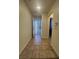 Tiled entryway featuring modern door and neutral paint, creating a welcoming and clean space at 6545 Netherseal Ave, Las Vegas, NV 89139