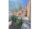 A charming front yard with lush greenery and a small, decorative fence at 6545 Netherseal Ave, Las Vegas, NV 89139