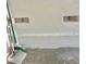Garage featuring a concrete floor, white-painted block walls, and screened vents at 6545 Netherseal Ave, Las Vegas, NV 89139