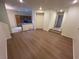 The spacious living room flows seamlessly into the kitchen, boasting hardwood floors and ample natural light at 6545 Netherseal Ave, Las Vegas, NV 89139