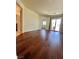 Spacious living area with wood floors and sliding glass doors at 6545 Netherseal Ave, Las Vegas, NV 89139