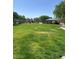 Park featuring a large green field, gazebo, playground, and walking path at 6545 Netherseal Ave, Las Vegas, NV 89139