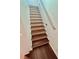 Bright staircase featuring wood steps and white risers at 6545 Netherseal Ave, Las Vegas, NV 89139