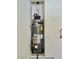 New water heater in a small closet or alcove with an electrical outlet nearby at 6545 Netherseal Ave, Las Vegas, NV 89139