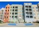 Community basketball court with colorful apartment buildings in the background at 68 E Serene Ave # 224, Las Vegas, NV 89123