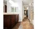 Bathroom with dual sink vanity, glass shower and walk-in closet at 68 E Serene Ave # 224, Las Vegas, NV 89123