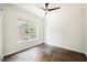 Bright bedroom with stylish tile flooring and a modern ceiling fan at 68 E Serene Ave # 224, Las Vegas, NV 89123