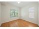 Bedroom with natural light, hardwood floors and two windows for a sunny ambiance at 68 E Serene Ave # 224, Las Vegas, NV 89123