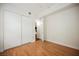 Bedroom featuring hardwood flooring, closet, and bright natural light at 68 E Serene Ave # 224, Las Vegas, NV 89123