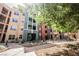 Exterior view of condominiums showcasing the multiple levels, balcony and desert landscaping at 68 E Serene Ave # 224, Las Vegas, NV 89123
