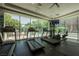 Modern fitness center with treadmills, stationary bikes and views of pool at 68 E Serene Ave # 224, Las Vegas, NV 89123