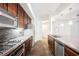 Kitchen with stainless appliances, stone counter tops, and stone backsplash at 68 E Serene Ave # 224, Las Vegas, NV 89123
