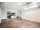 Bright, open living room features a modern ceiling fan and adjacent kitchen with stainless appliances at 68 E Serene Ave # 224, Las Vegas, NV 89123