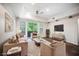 Modern living room featuring tile flooring, recessed lighting, balcony access and a media center at 68 E Serene Ave # 224, Las Vegas, NV 89123