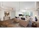 Staged living area featuring tile flooring, recessed lighting, and a sliding glass door at 68 E Serene Ave # 224, Las Vegas, NV 89123