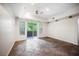 Bright, open living room with tile flooring, recessed lighting, and sliding glass doors to the balcony at 68 E Serene Ave # 224, Las Vegas, NV 89123