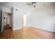 Bright main bedroom with hardwood floors, recessed lighting and doorways to a bathroom and closet at 68 E Serene Ave # 224, Las Vegas, NV 89123