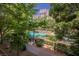 A stunning swimming pool with lounge chairs, nestled within a lush, landscaped community at 68 E Serene Ave # 224, Las Vegas, NV 89123