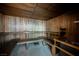 Wood paneled sauna room with wooden benches, heater and tiled floor at 68 E Serene Ave # 224, Las Vegas, NV 89123