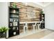 Shared community workspace featuring built-in shelves and chairs with modern lighting at 68 E Serene Ave # 224, Las Vegas, NV 89123
