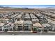 Rows of modern homes in an aerial shot, showing neighborhood streets and a clear blue sky at 6848 Sunflower Fields St, North Las Vegas, NV 89086