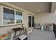 This comfortable balcony has an outdoor living space with multiple chairs to enjoy the views from the house at 6848 Sunflower Fields St, North Las Vegas, NV 89086