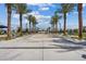 View of community area featuring palm trees, benches and sheltered seating area at 6848 Sunflower Fields St, North Las Vegas, NV 89086