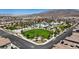 Scenic community aerial view featuring green spaces, pool, and well-manicured streets and homes at 6848 Sunflower Fields St, North Las Vegas, NV 89086