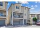 Modern two-story home with a balcony, neutral stucco, and an attached garage, offering contemporary living at 6848 Sunflower Fields St, North Las Vegas, NV 89086