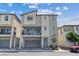 Stylish two-story home featuring a balcony, neutral colors, an attached garage, and a charming wreath on the front door at 6848 Sunflower Fields St, North Las Vegas, NV 89086