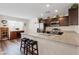 Well-equipped kitchen with granite countertops, stainless steel appliances and breakfast bar seating at 6848 Sunflower Fields St, North Las Vegas, NV 89086