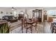 Open living and dining areas feature stylish decor, dark wood floors, and lots of natural light at 6848 Sunflower Fields St, North Las Vegas, NV 89086