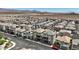 Aerial view of a well-planned neighborhood with uniform housing, neat landscaping, and desert views at 6848 Sunflower Fields St, North Las Vegas, NV 89086