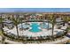 Community pool and gathering area with palm trees and lounge chairs in an upscale neighborhood at 6848 Sunflower Fields St, North Las Vegas, NV 89086