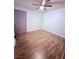 This bedroom features luxury vinyl flooring and an updated door at 7123 Kenwood St, Las Vegas, NV 89147