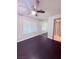 This bedroom features dark luxury vinyl flooring and a window at 7123 Kenwood St, Las Vegas, NV 89147