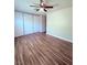This bedroom features luxury vinyl flooring and a ceiling fan at 7123 Kenwood St, Las Vegas, NV 89147