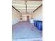 Attached garage with storage shelves, a door to the home, and laundry area at 7123 Kenwood St, Las Vegas, NV 89147