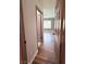 Hallway showing wood-look flooring and access to another living space at 7123 Kenwood St, Las Vegas, NV 89147