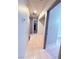 This hallway features tile flooring and neutral colored walls at 7123 Kenwood St, Las Vegas, NV 89147