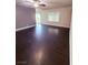 Bright living room with ceiling fan and sliding doors for ample natural light at 7123 Kenwood St, Las Vegas, NV 89147
