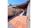 View of the brick-paved patio with a covered extension featuring a desert landscaped garden at 7123 Kenwood St, Las Vegas, NV 89147