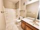 Clean bathroom with a tub and shower combination, toilet, and single sink vanity with storage at 7135 S Durango Dr # 314, Las Vegas, NV 89113