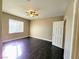 Comfortable bedroom with hardwood floors, ceiling fan, and a window providing natural light at 7135 S Durango Dr # 314, Las Vegas, NV 89113