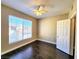 Bright bedroom with large window, hardwood floors, and neutral paint, offering a serene atmosphere at 7135 S Durango Dr # 314, Las Vegas, NV 89113