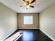 Empty bedroom featuring hardwood floors, a ceiling fan, and natural light from the window at 7135 S Durango Dr # 314, Las Vegas, NV 89113
