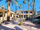 Beautiful courtyard with outdoor seating, manicured landscaping, and walkways creating a serene and inviting communal space at 7135 S Durango Dr # 314, Las Vegas, NV 89113