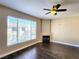 Comfortable living room featuring a cozy fireplace, large window for natural light, and stylish hardwood floors, great for relaxation at 7135 S Durango Dr # 314, Las Vegas, NV 89113