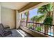 Balcony overlooking a community pool and surrounding palm trees and landscaping at 7173 S Durango Dr # 307, Las Vegas, NV 89113